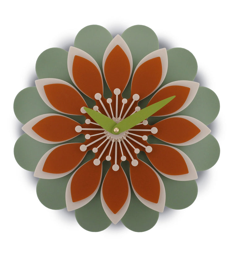 Flower acrylic wall clock with orange and green design on a white background