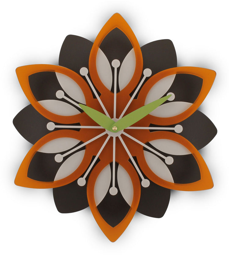 Decorative wall clock with a floral design in orange, black, and white on a white background