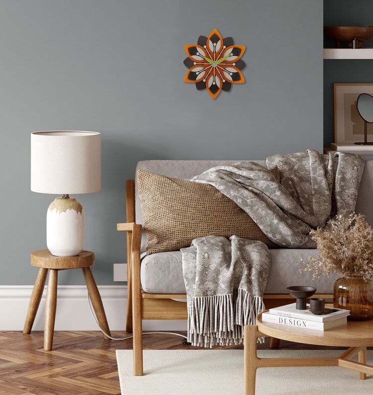 Decorative wall clock with floral design.