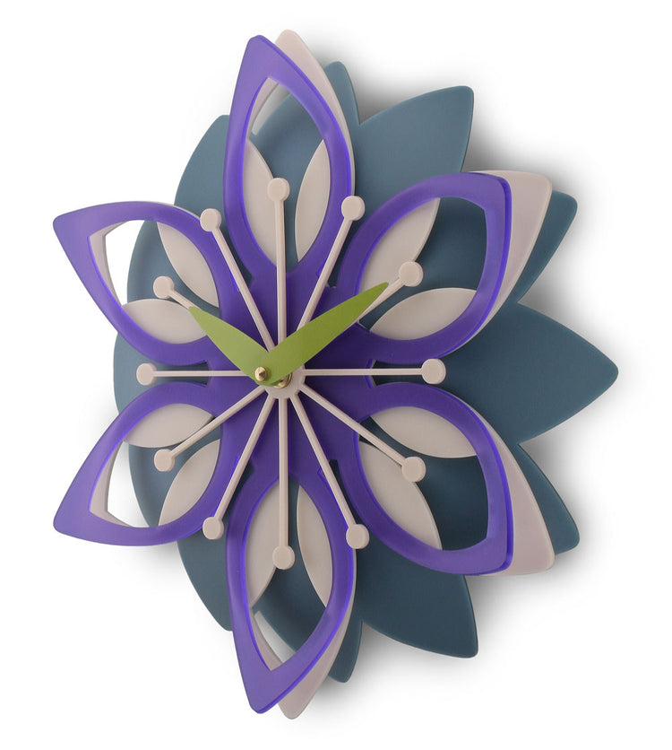 Decorative wall clock with a floral design in purple, blue, and white on a white background