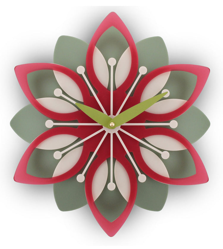 Decorative wall clock with a floral design in red, green, and white on a white background