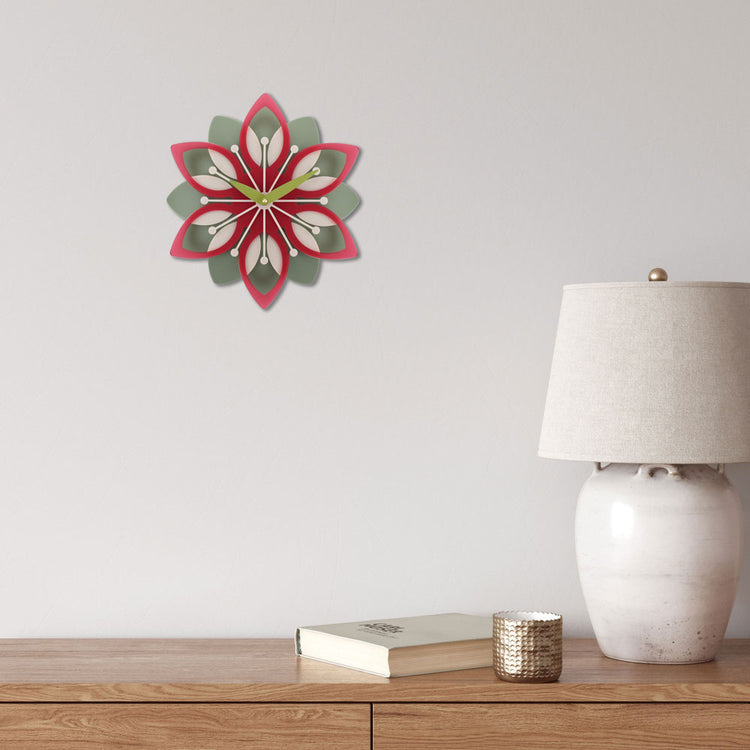Decorative wall clock with floral design.