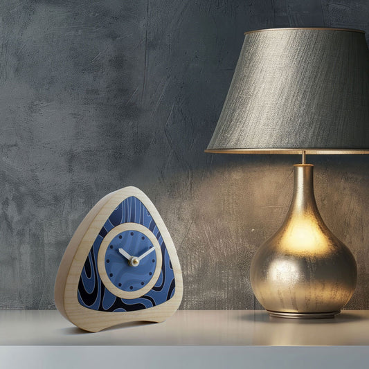 Decorative desk clock with blue contour line patterned dial and syamore wooden casing.