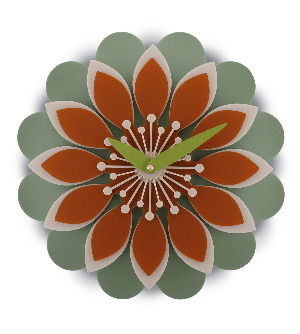 Flower acrylic wall clock with orange and green design on a white background