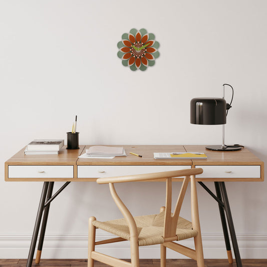 Decorative acrylic wall clock shaped like a flower in orange and green.